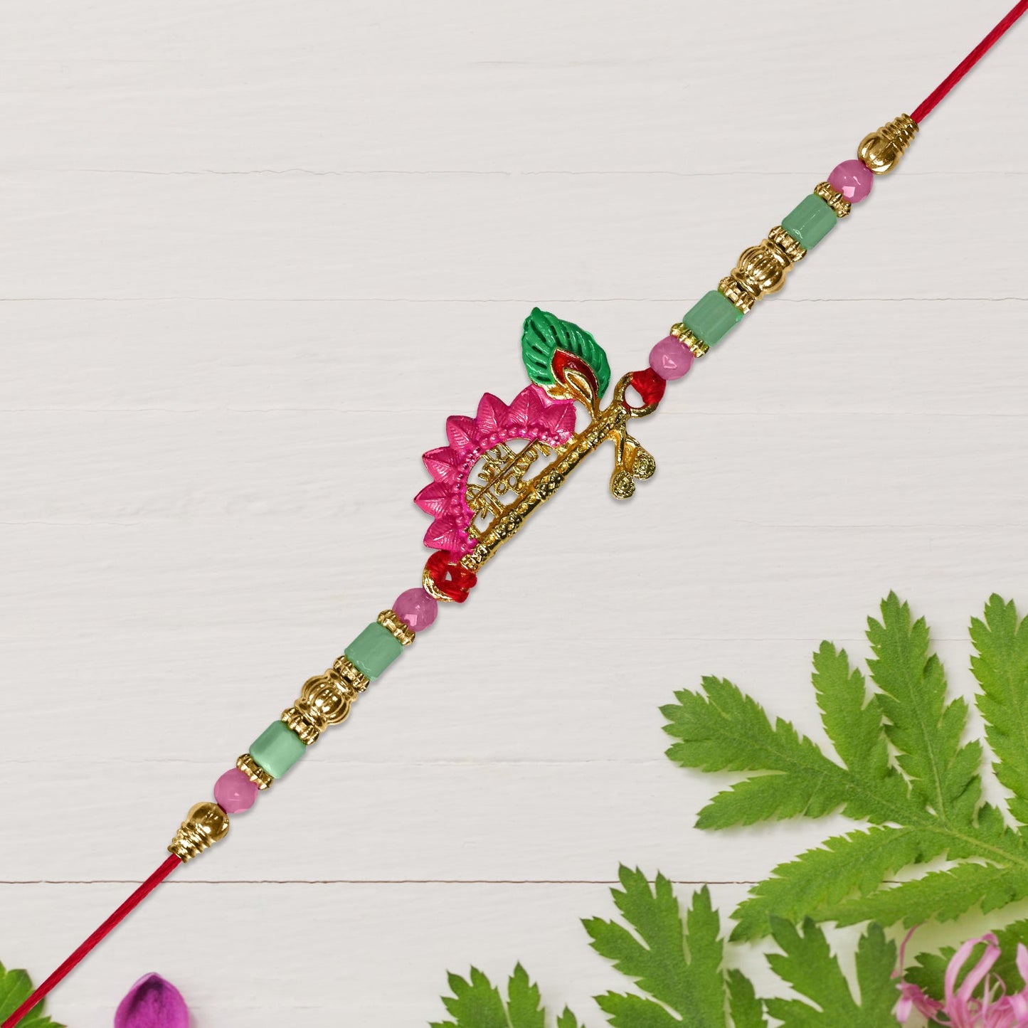 Mor Pankh Flute Rakhi with Pink Accents