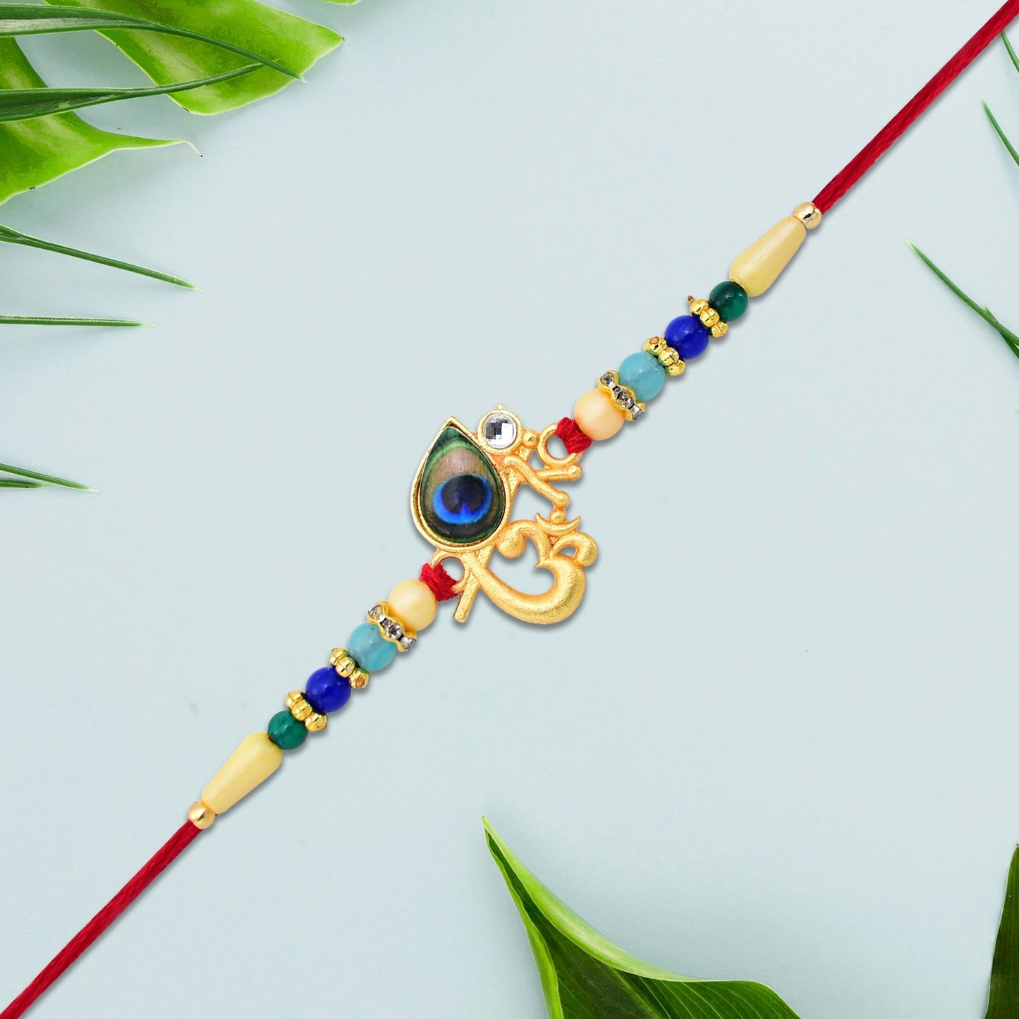 Divine Govind Rakhi with Peacock Feather Design and Multicolor Beads