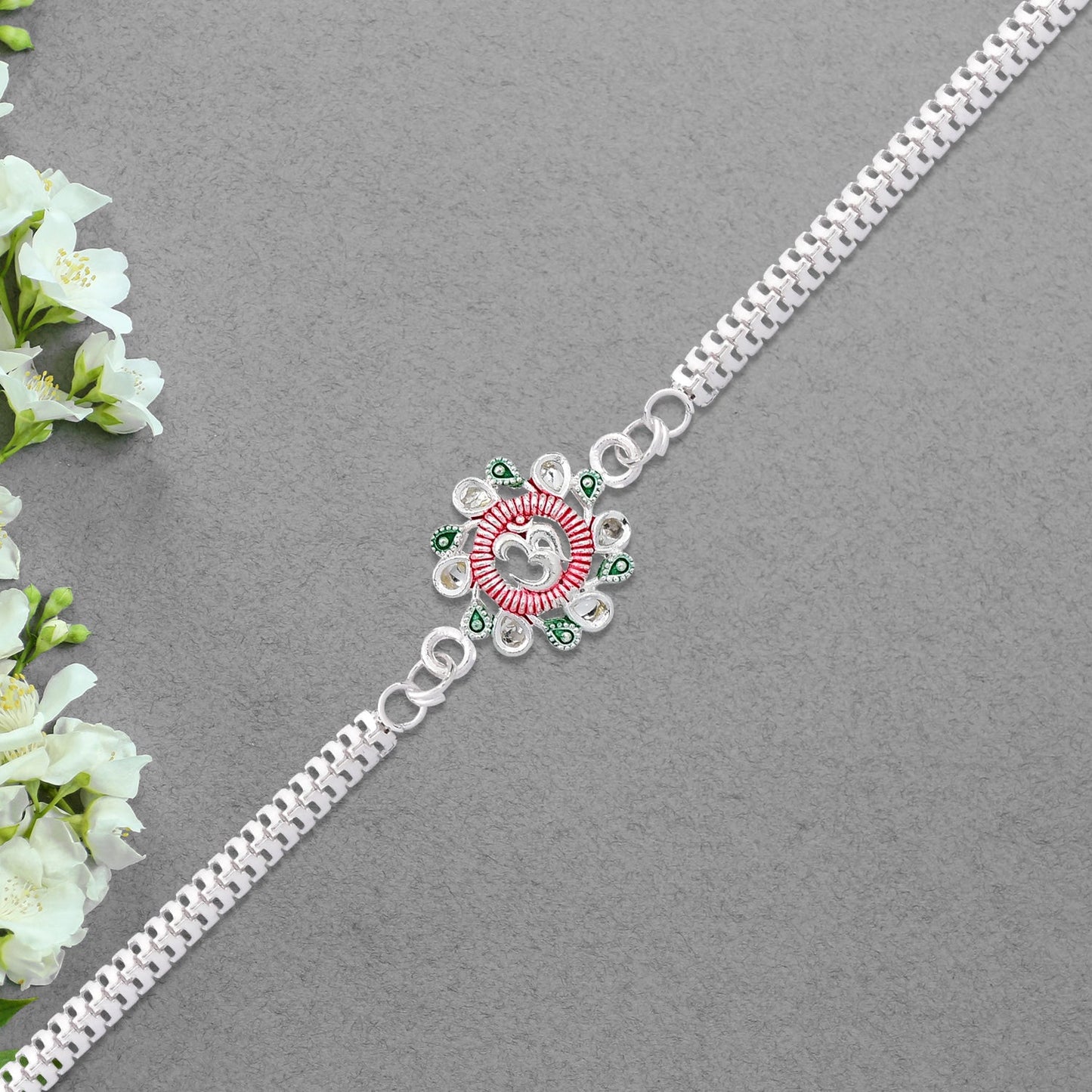 Elegant Floral Om Rakhi with Pink-Green Accents