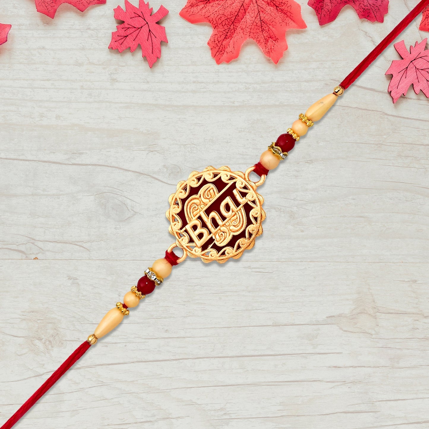 Golden Swastik Rakhi with Red Beads and Thread