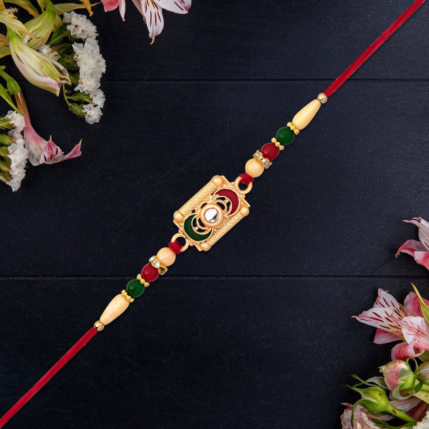 Rectangular Meenakari Rakhi with Golden Base and Red-Green Beads