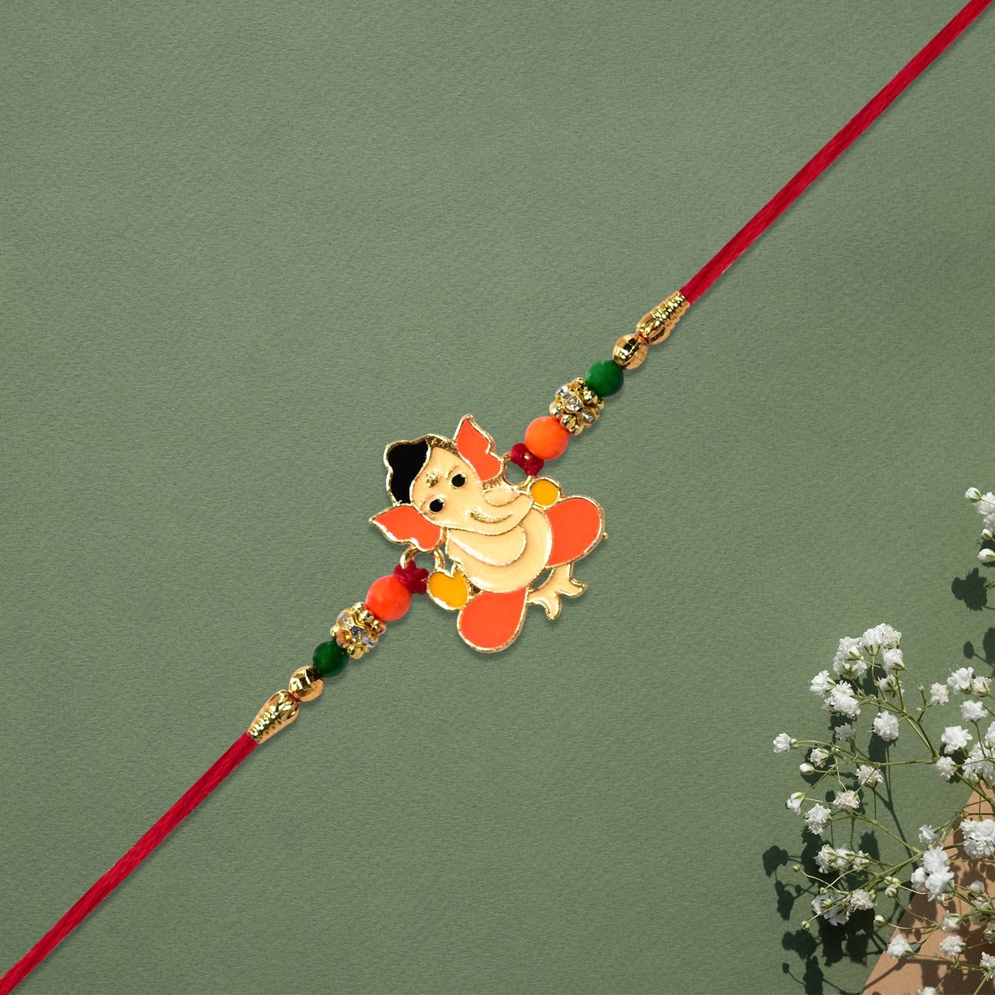 Cute Bal Ganesha Rakhi with Orange-Green Beads and Red Thread