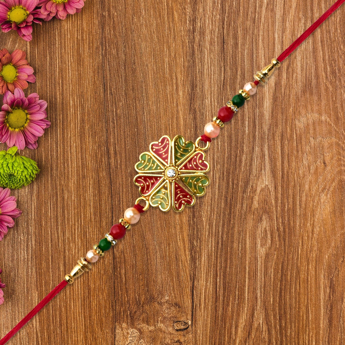 Traditional Rakhi with Bright Floral Centerpiece and Decorative Thread