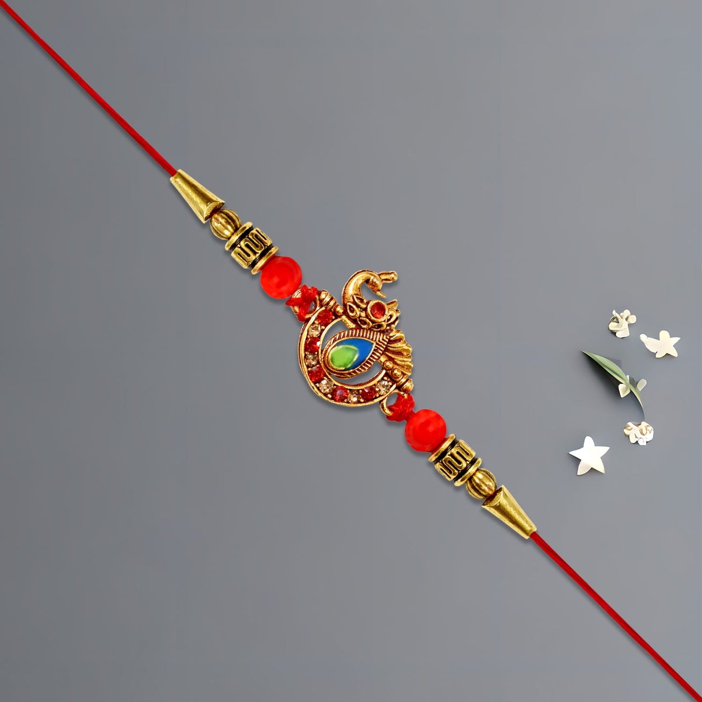 Golden Peacock Rakhi with Red Beads