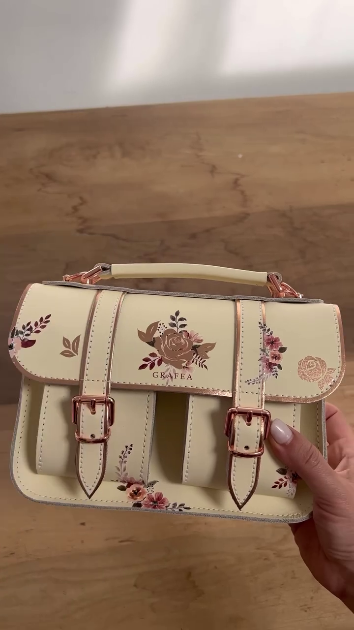 Floral & Transparent Leather Satchels Collection – Elegant Cream Floral Design with Rose Gold Accents, Clear Pink Butterfly-Printed Satchel with Gold Details, and Stylish Vintage-Inspired Handbags