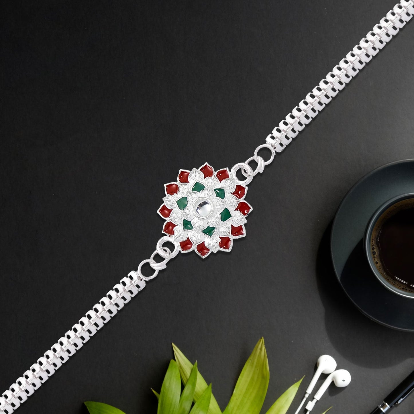 Traditional Floral Rakhi with Red & Green Stones – Silver Designer Rakhi for Brother