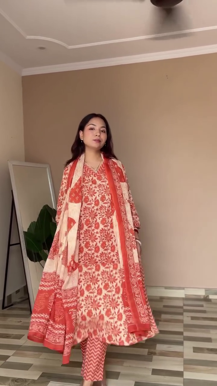 A charming blue and white floral ethnic outfit with a delicate kurta, matching dupatta, and pants, paired with traditional bangles, perfect for a relaxed yet elegant look.