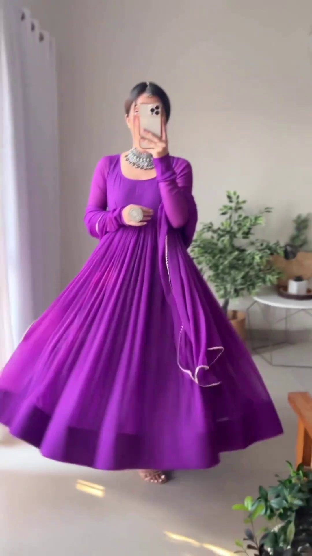 Elegant Purple Anarkali Dress with Pleated Detailing and Sheer Dupatta, Accentuated by a Statement Silver Necklace, Ideal for Traditional Occasions and Festive Celebrations