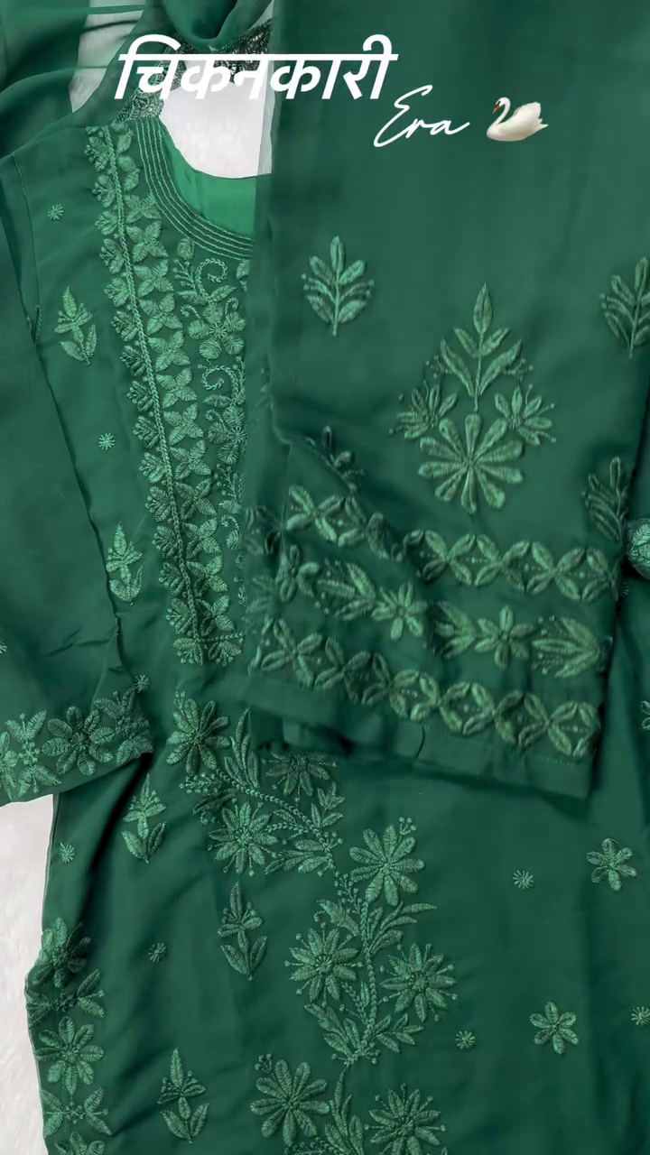 A beautiful green chikankari kurta set with delicate floral embroidery on the sleeves and dupatta, perfect for a traditional or festive look. Ask ChatGPT
