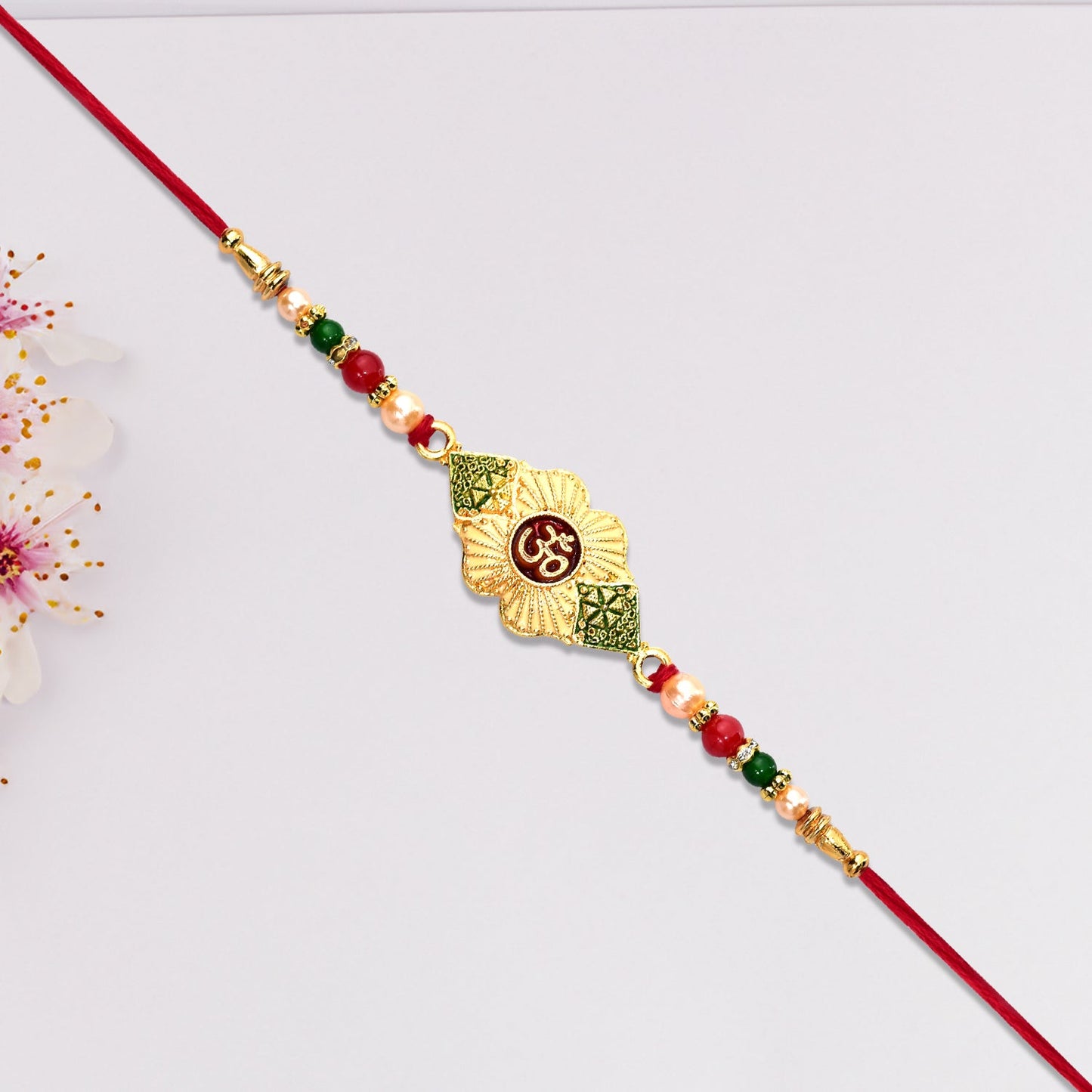Divine Ganpati Rakhi with Enamel Work and Traditional Beads