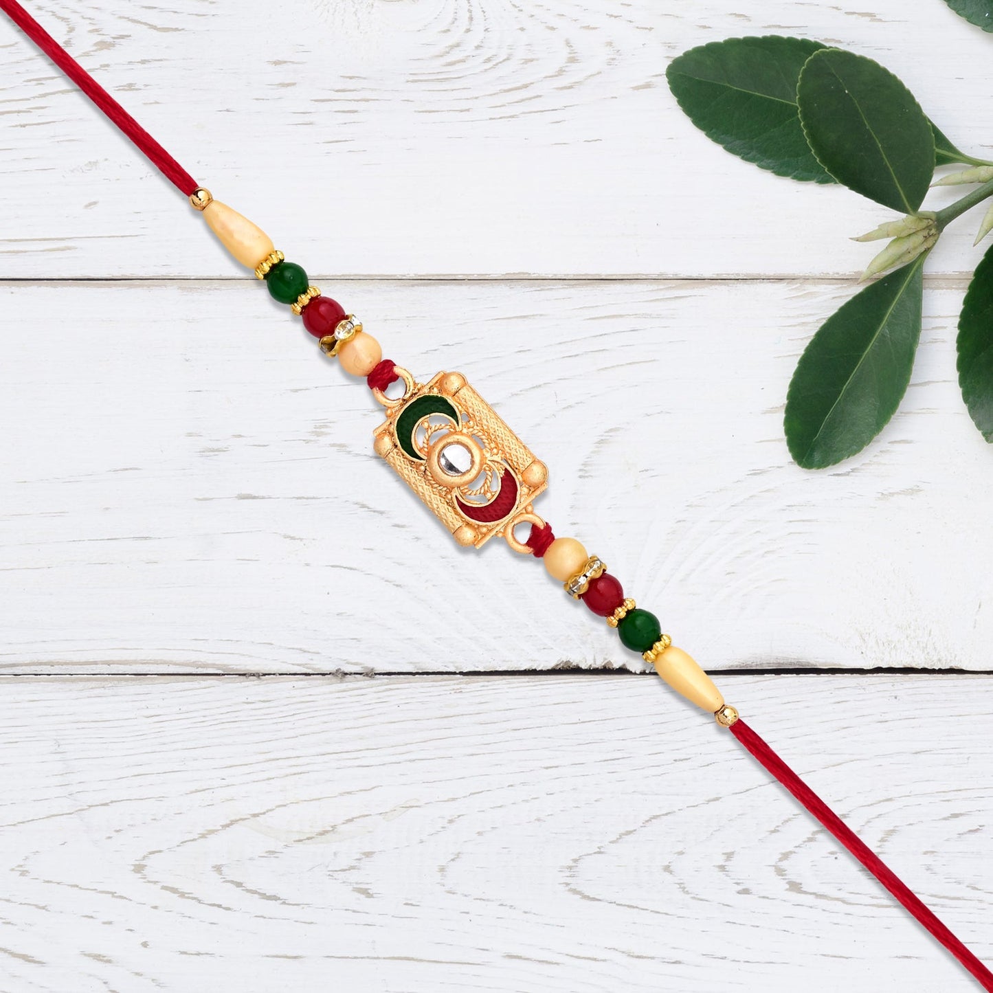 Rectangular Meenakari Rakhi with Golden Base and Red-Green Beads