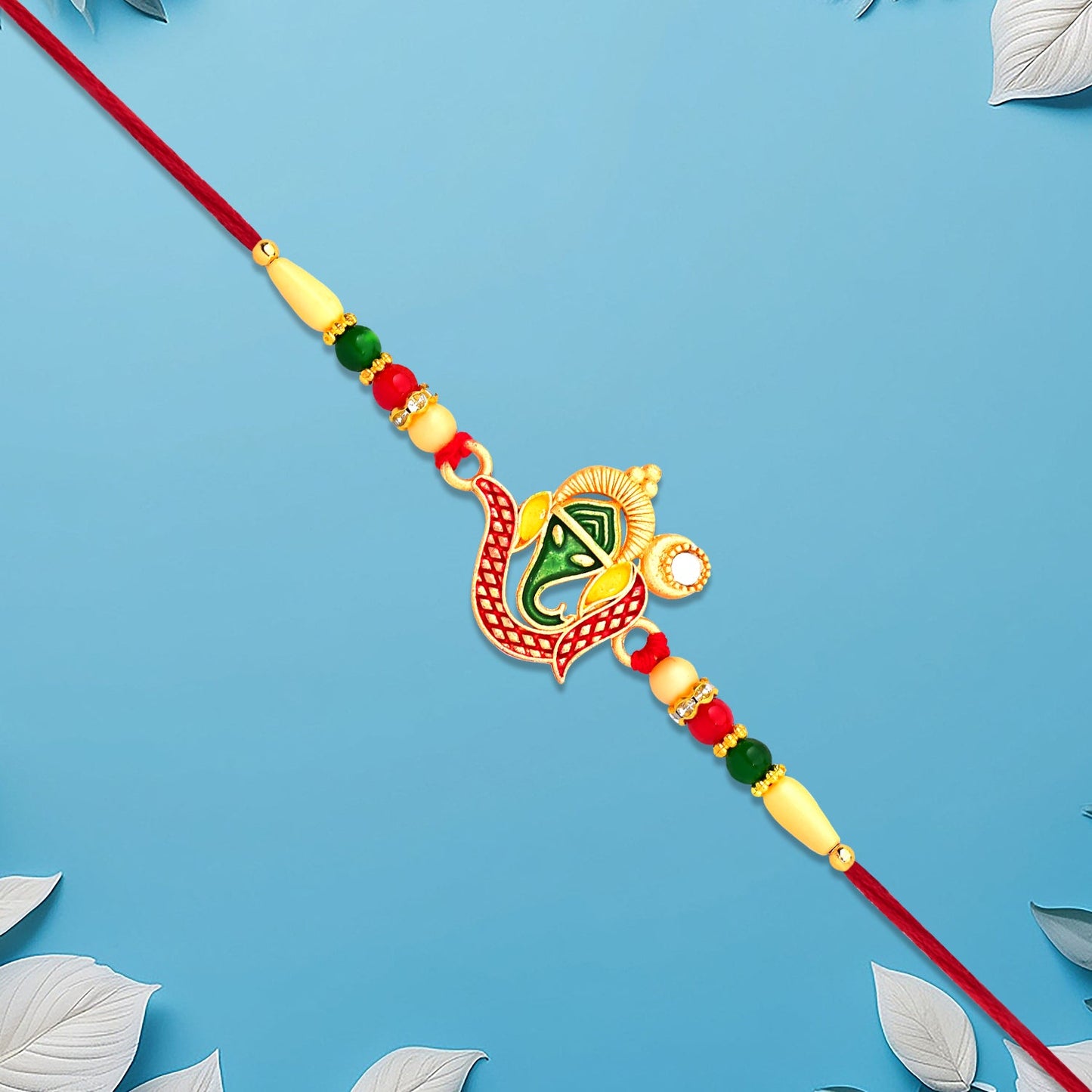 Green Enamel Lord Ganesha Rakhi with Decorative Red Thread and Golden Accents