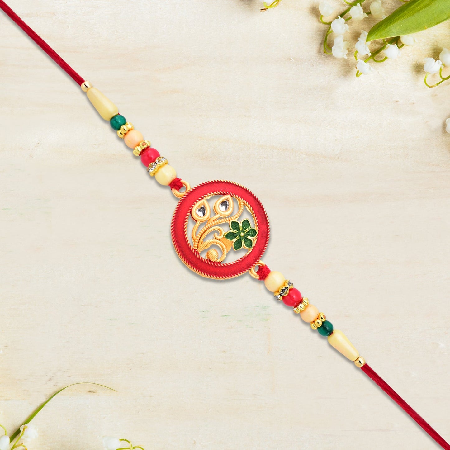 Round Designer Paisley Rakhi with Floral Charm