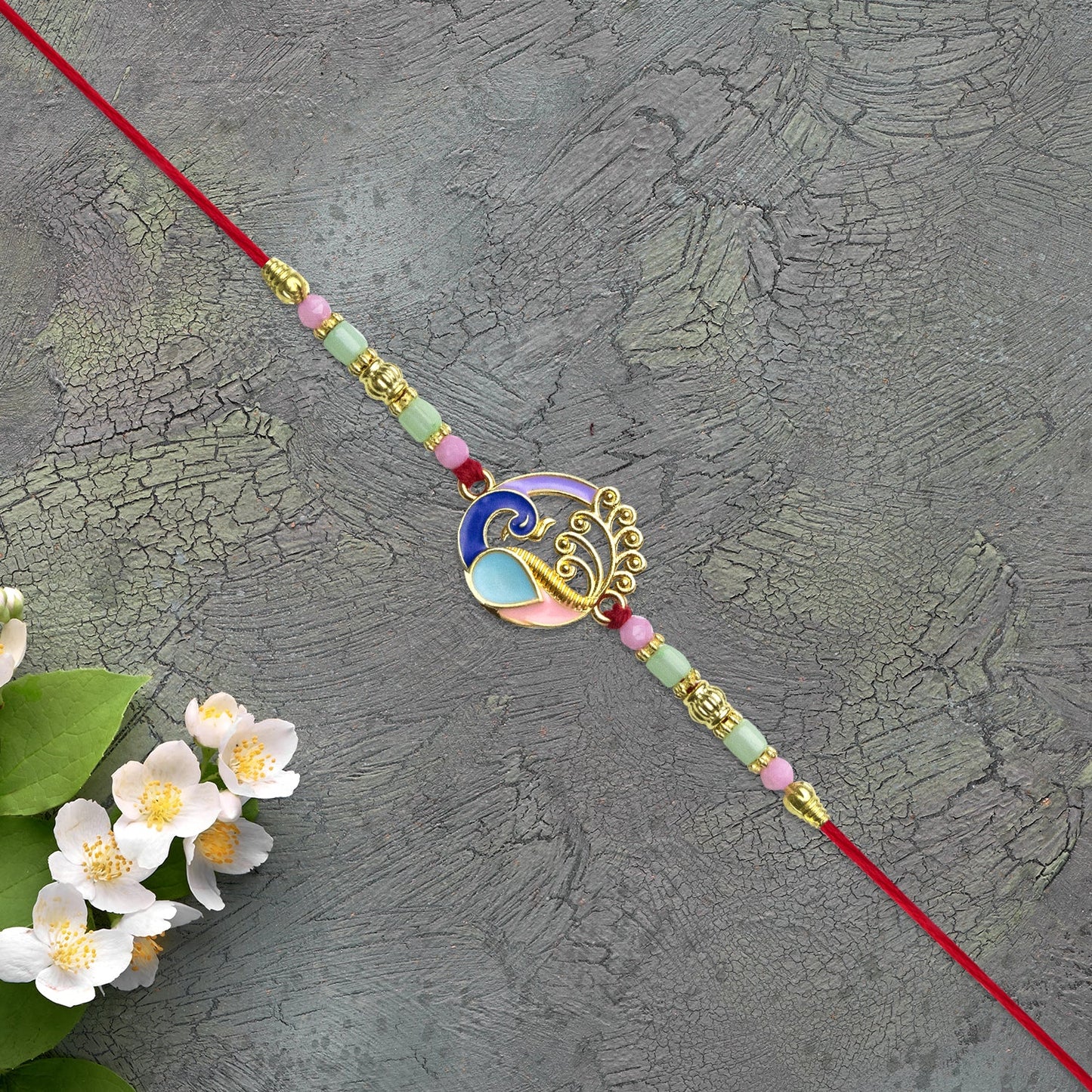 Elegant Conch Shell Rakhi with Enamel Detailing and Beads