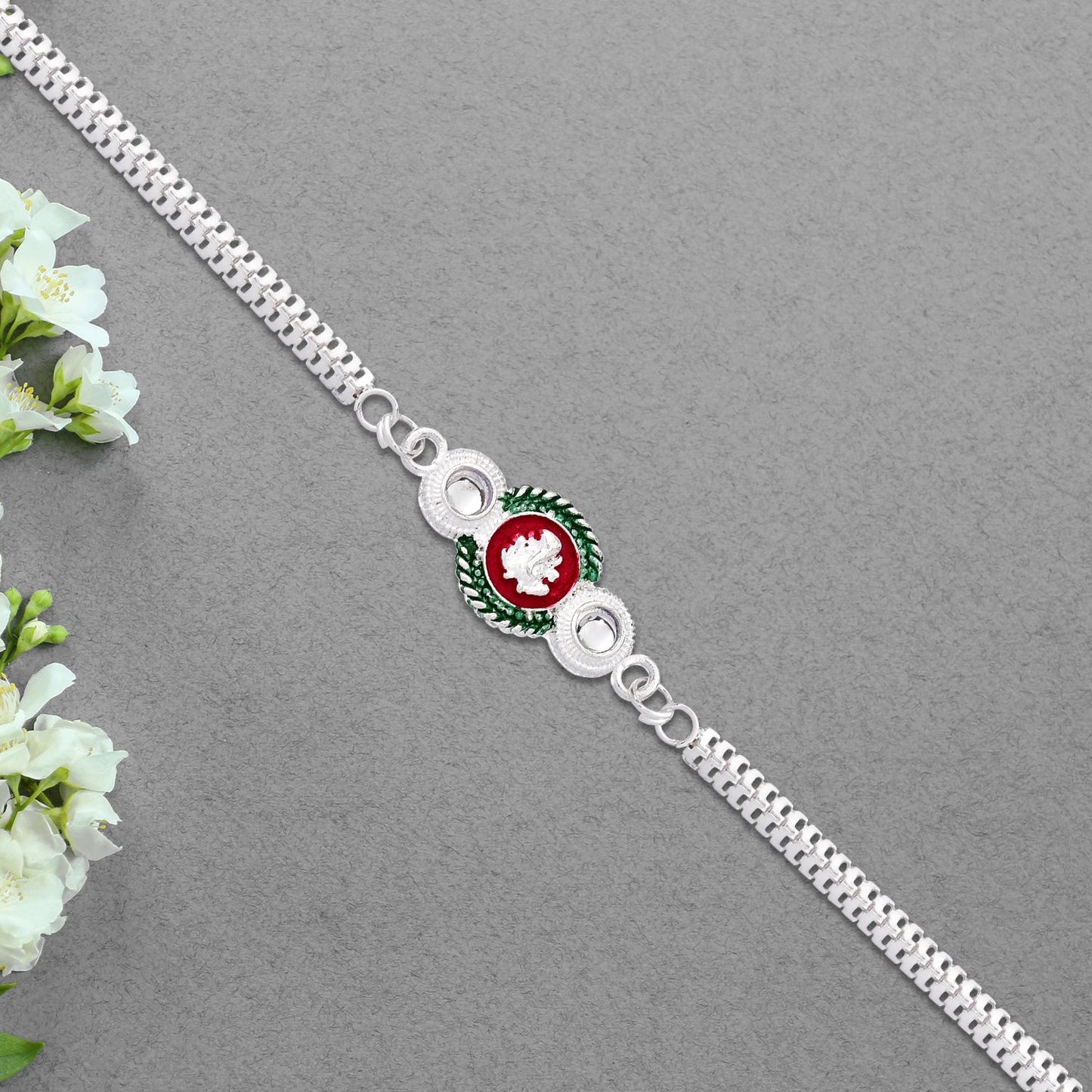 Shiny Silver Rakhi with Ganesha Emblem and Elegant Dual Chain Design