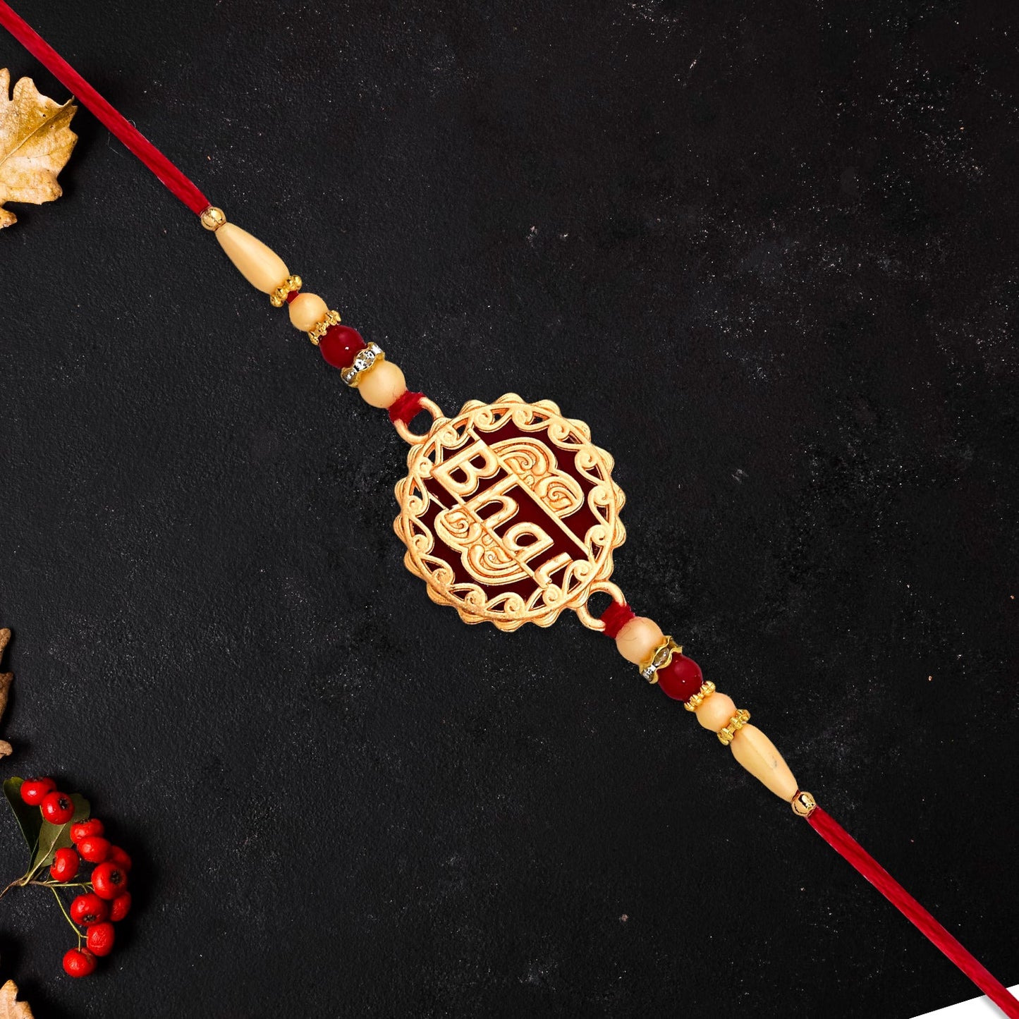 Golden Swastik Rakhi with Red Beads and Thread