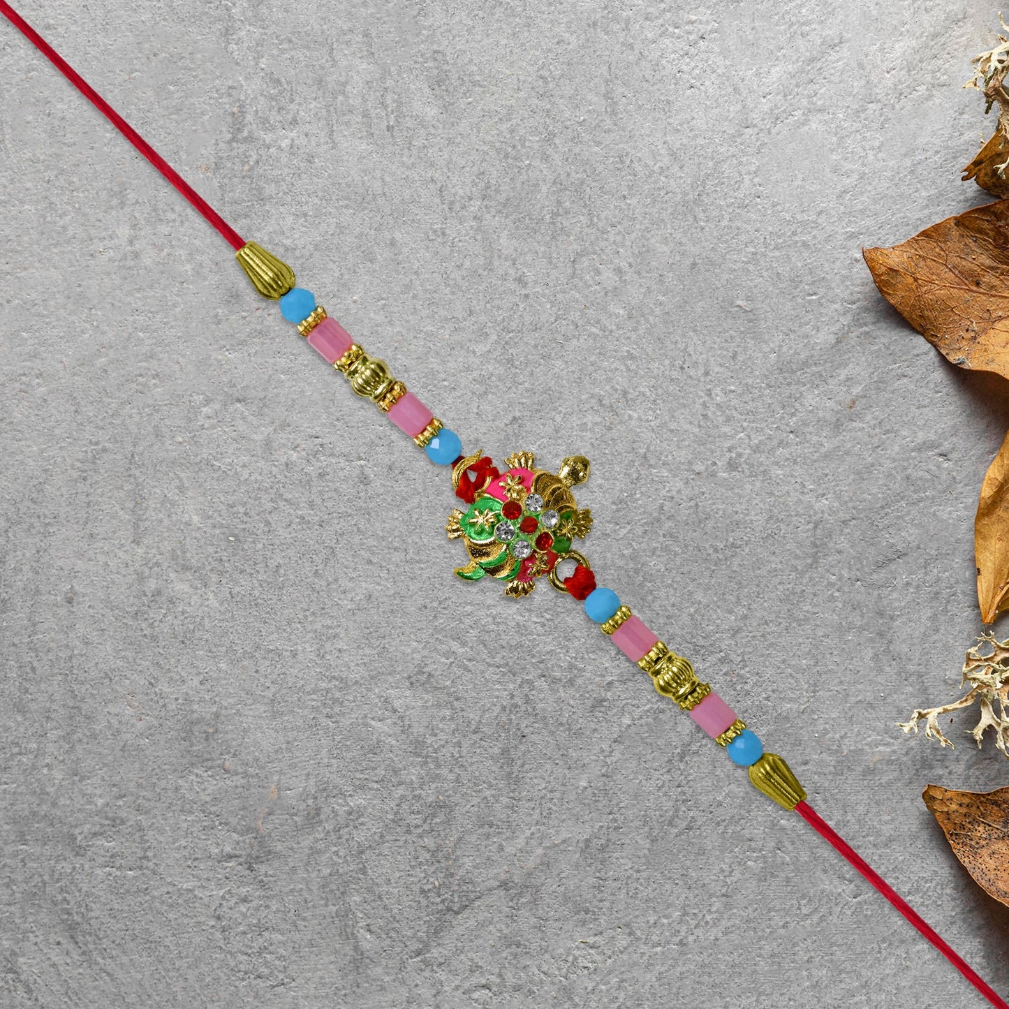 Turtle Design Rakhi with Floral Accents and Beads
