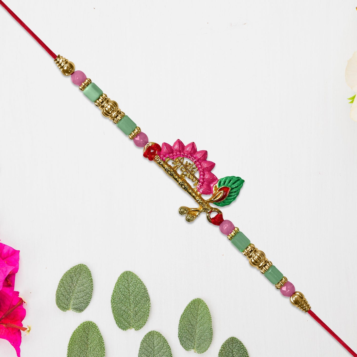 Mor Pankh Flute Rakhi with Pink Accents