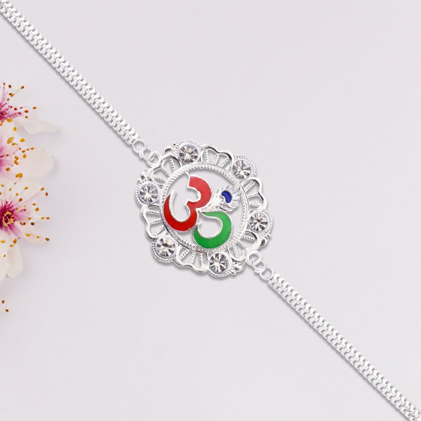 Silver OM Rakhi with Stone Embellishments