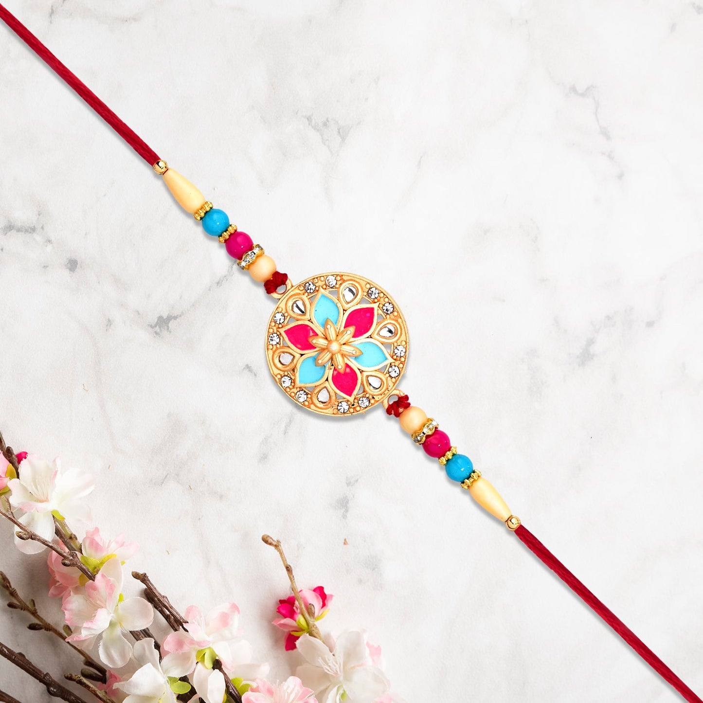Round Floral Rakhi with Pink-Blue Enamel and Beaded Thread