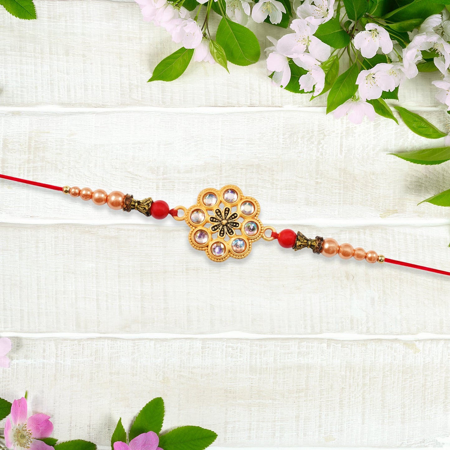 Gold-Toned Floral Rakhi with Pink Stones