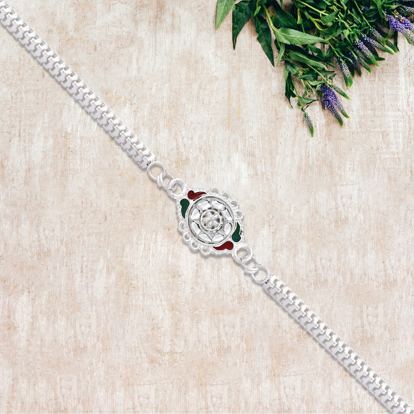 Stylish Rakhi with Intricate Floral Motif and Enamel Touches
