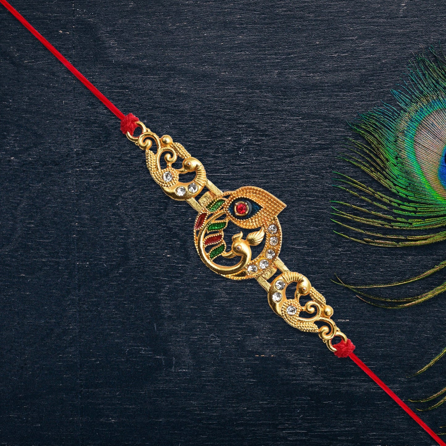 Golden Krishna Flute Rakhi with Colorful Enamel and Red Thread