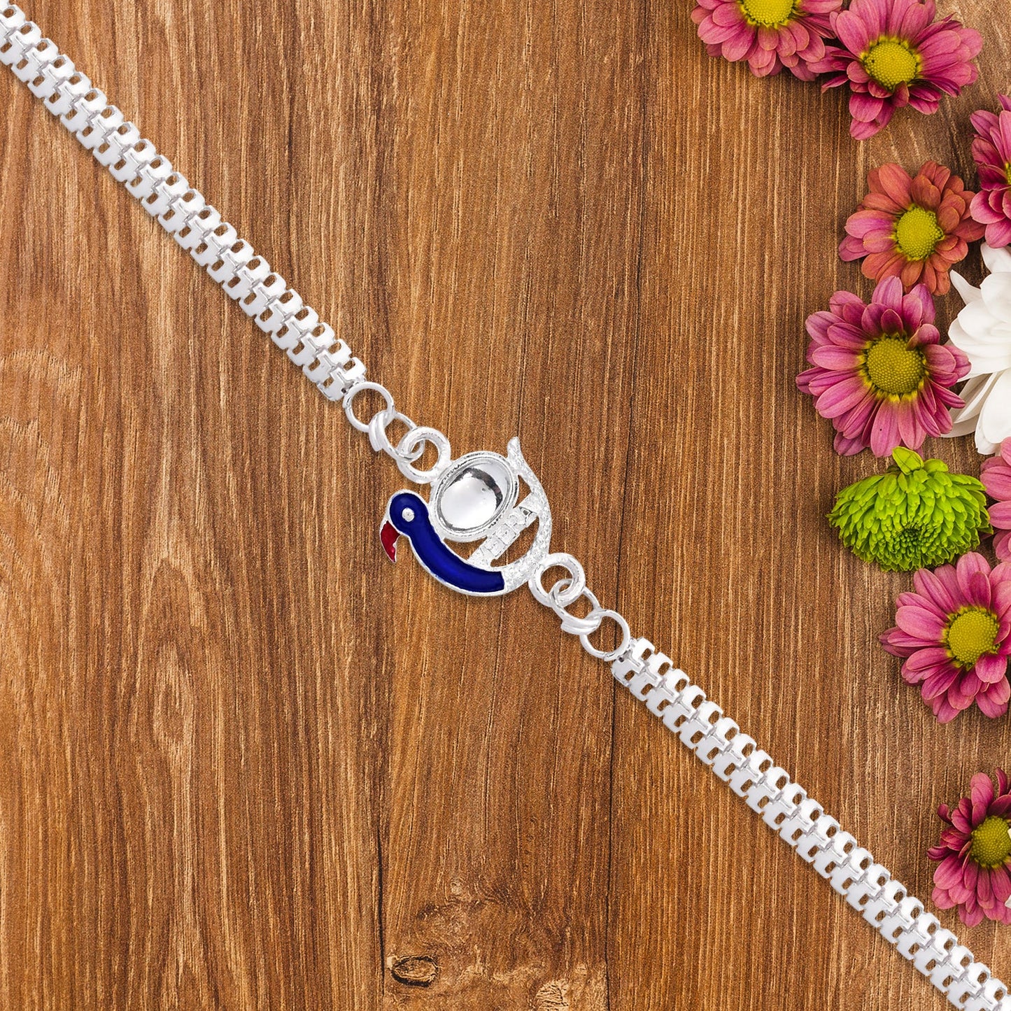 Elegant Peacock Design Rakhi with Blue Enamel and Silver Metal Chain