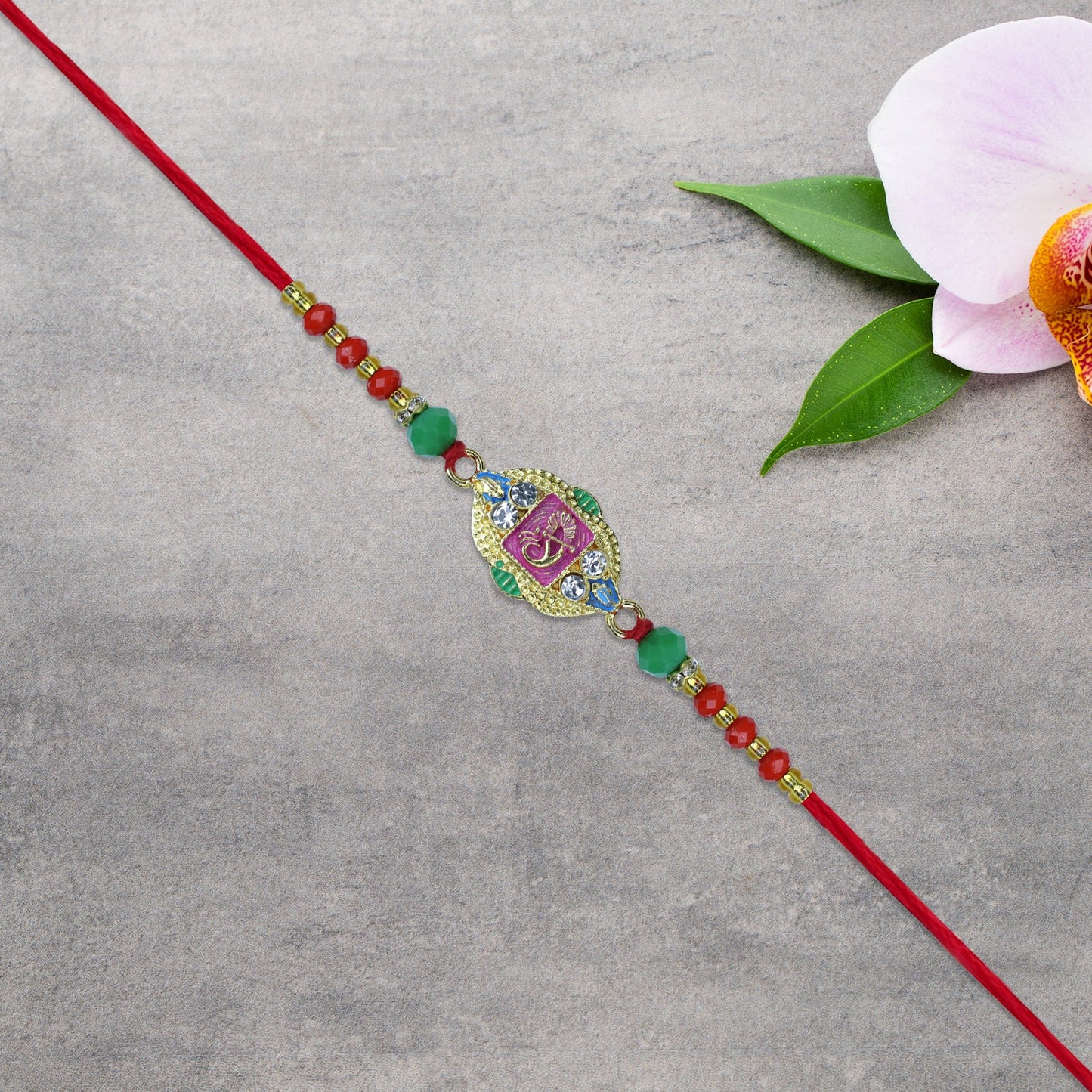 Om Rakhi with Decorative Beads and Stone Work
