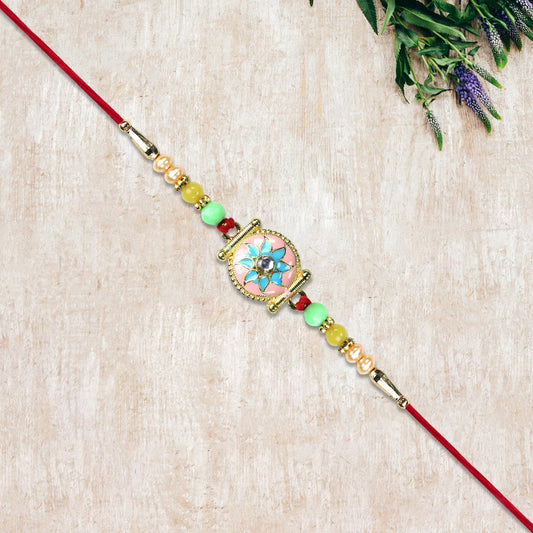 Designer Rakhi with Blue-Pink Flower and Decorative Beads