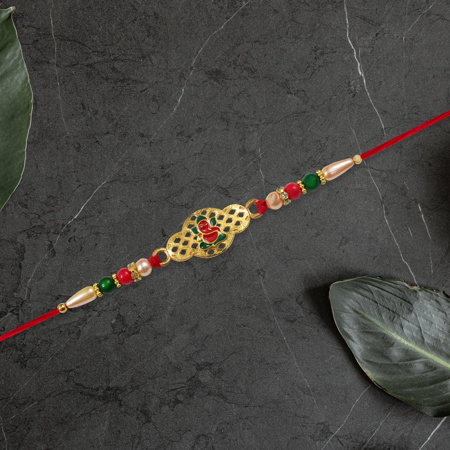 Religious Ganesha Rakhi in Gold Finish