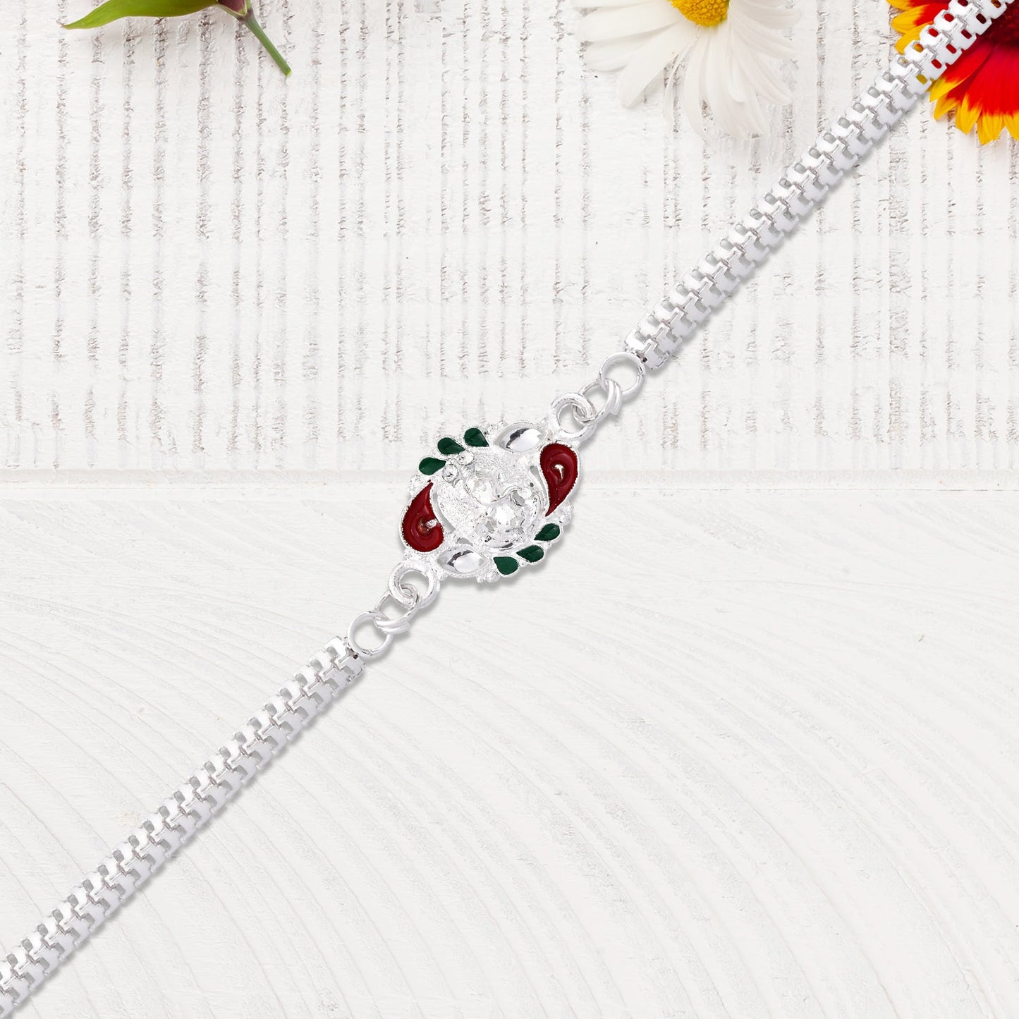 Designer Rakhi with Ornamental Floral Motif and Silver Finish Chain