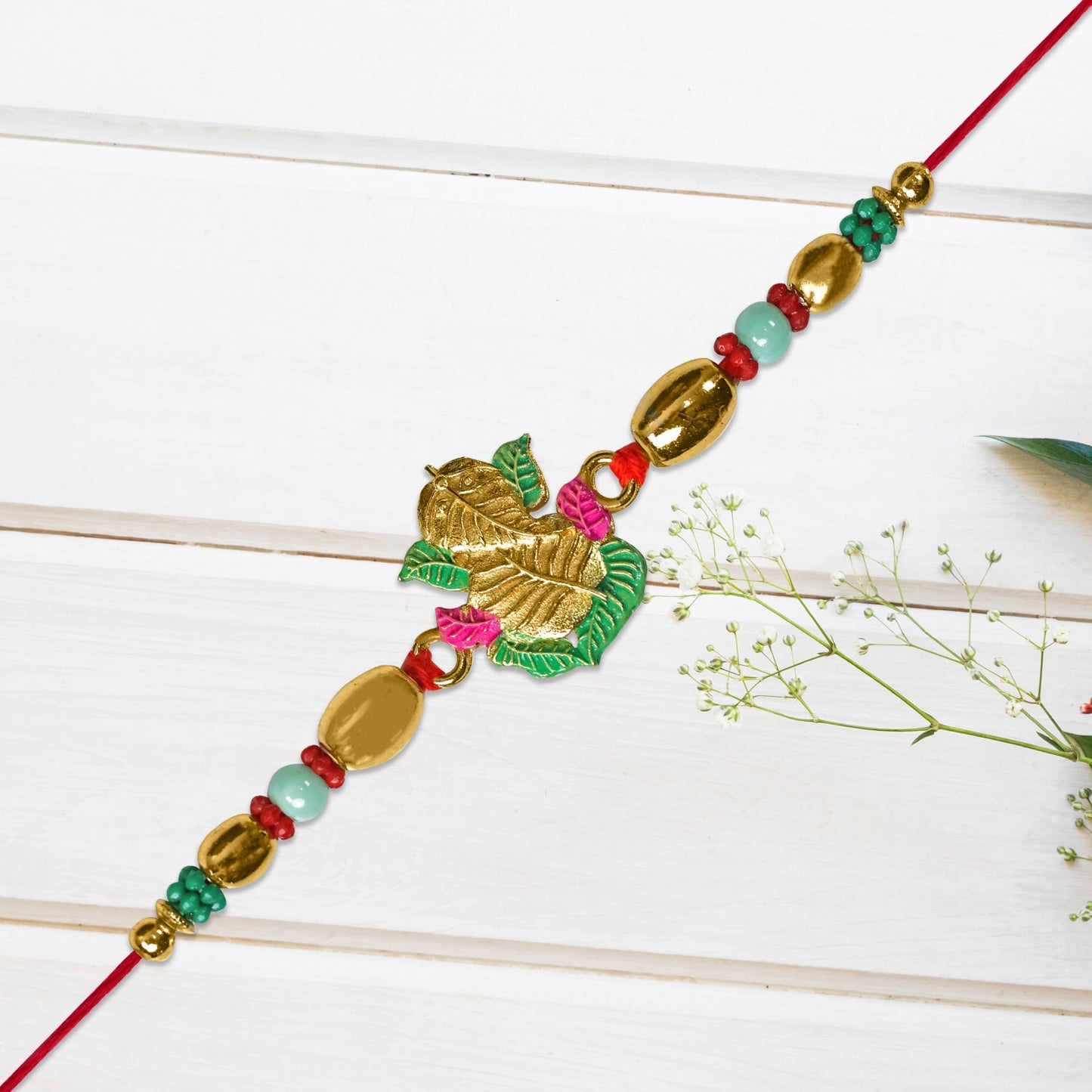 Golden Leaf Design Rakhi with Multicolor Beads