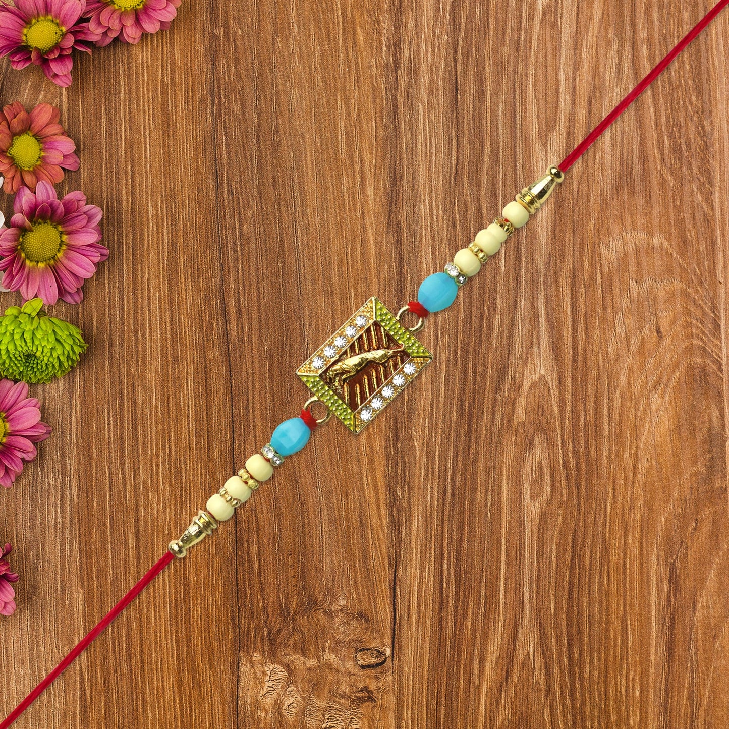 Leaping Deer Rakhi with Stone-Studded Frame and Beads