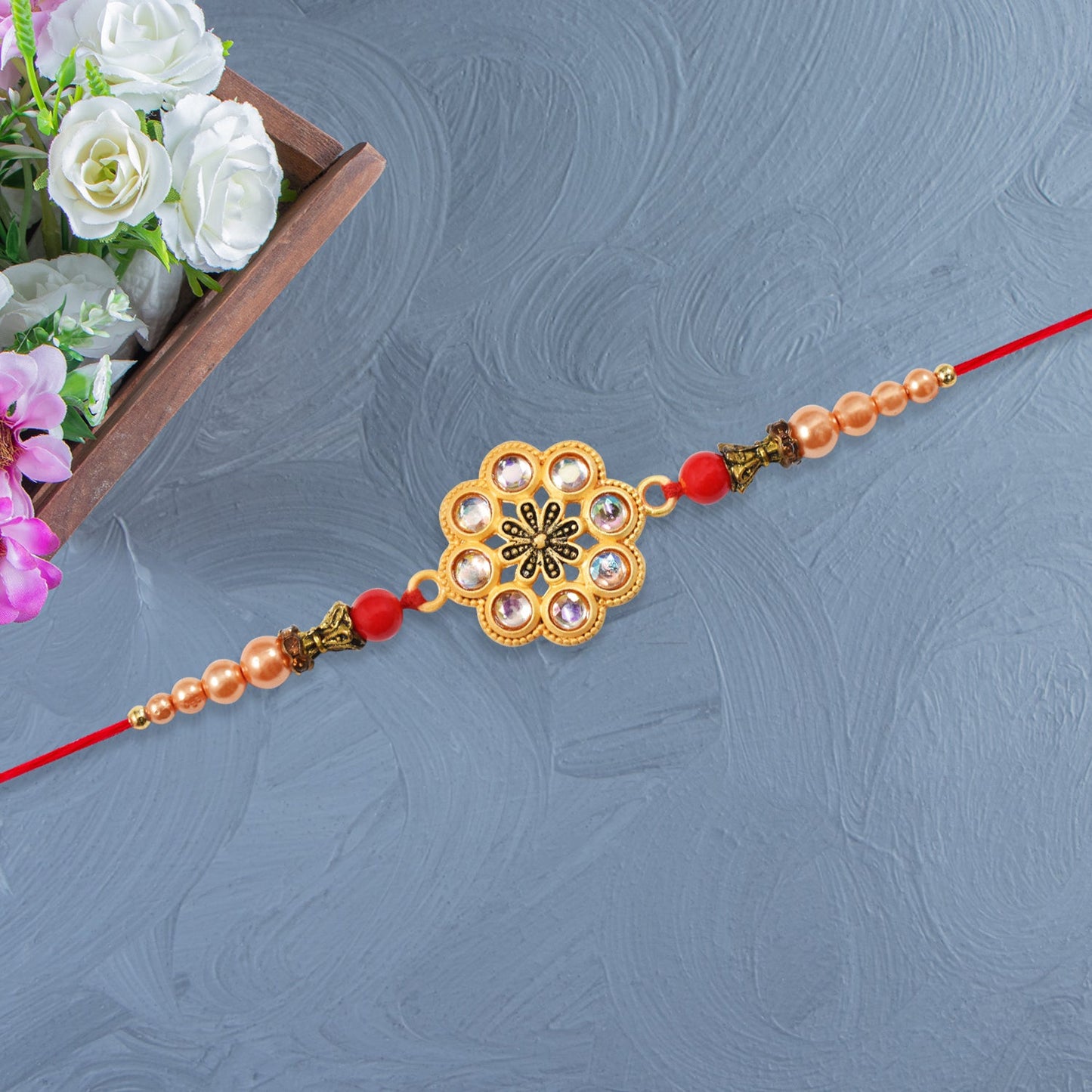 Gold-Toned Floral Rakhi with Pink Stones
