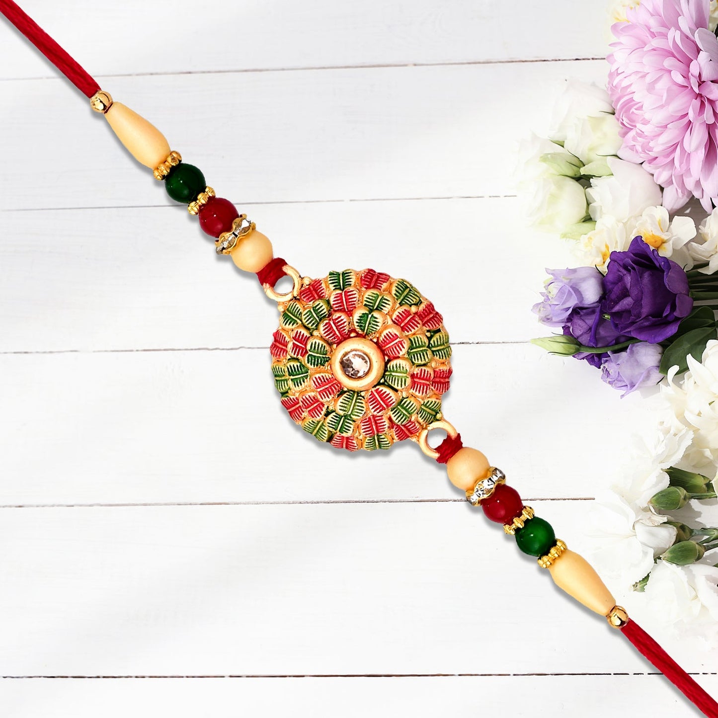 Traditional Kundan Rakhi with Golden Floral Base and Rudraksha Beads