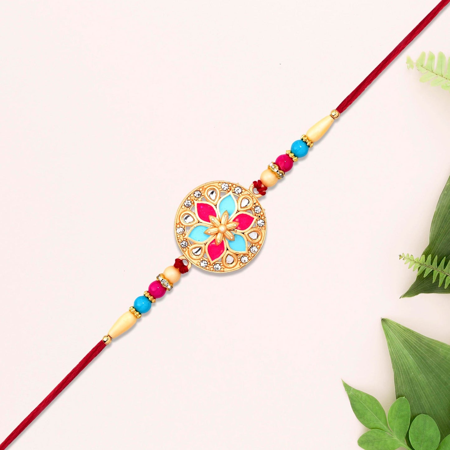 Round Floral Rakhi with Pink-Blue Enamel and Beaded Thread