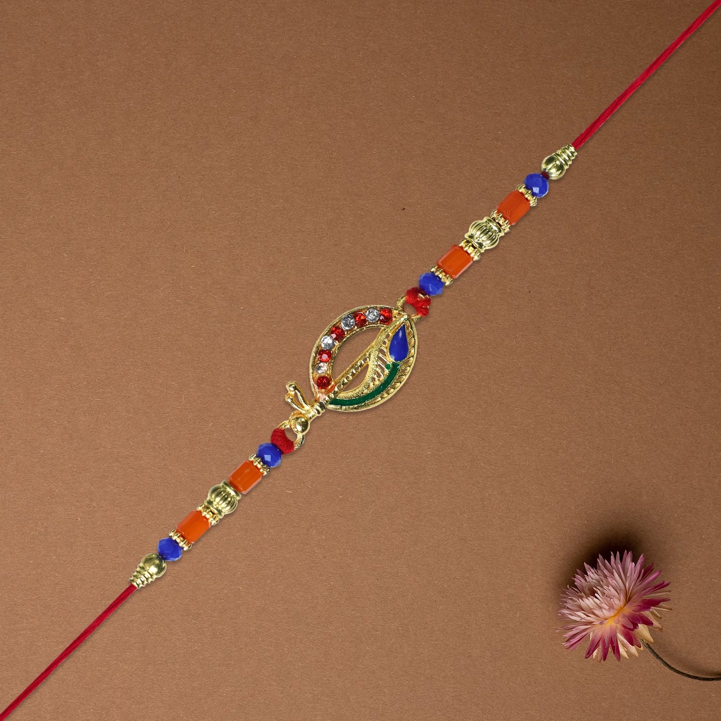 Traditional Dagger Rakhi with Colorful Beads and Stones