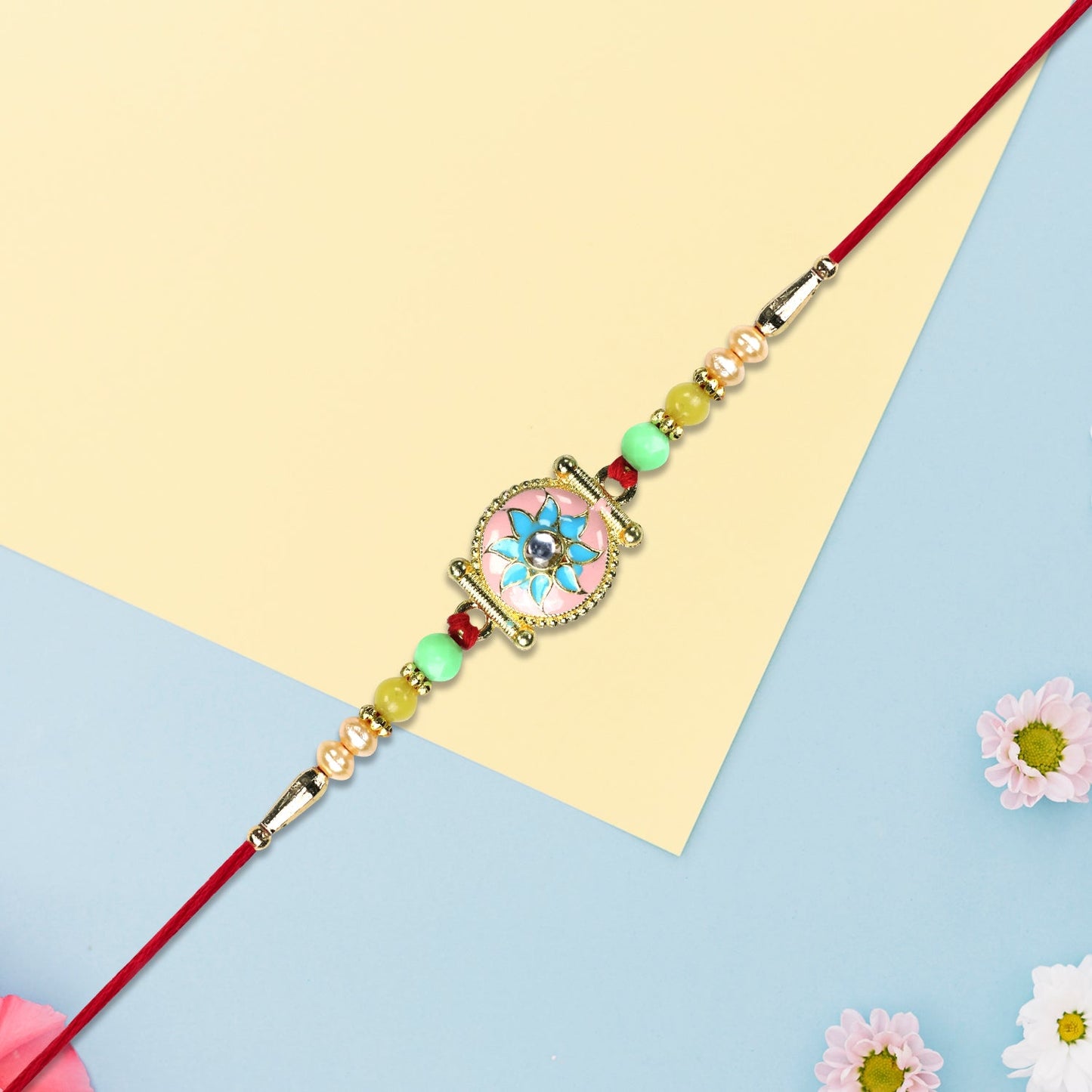 Designer Rakhi with Blue-Pink Flower and Decorative Beads