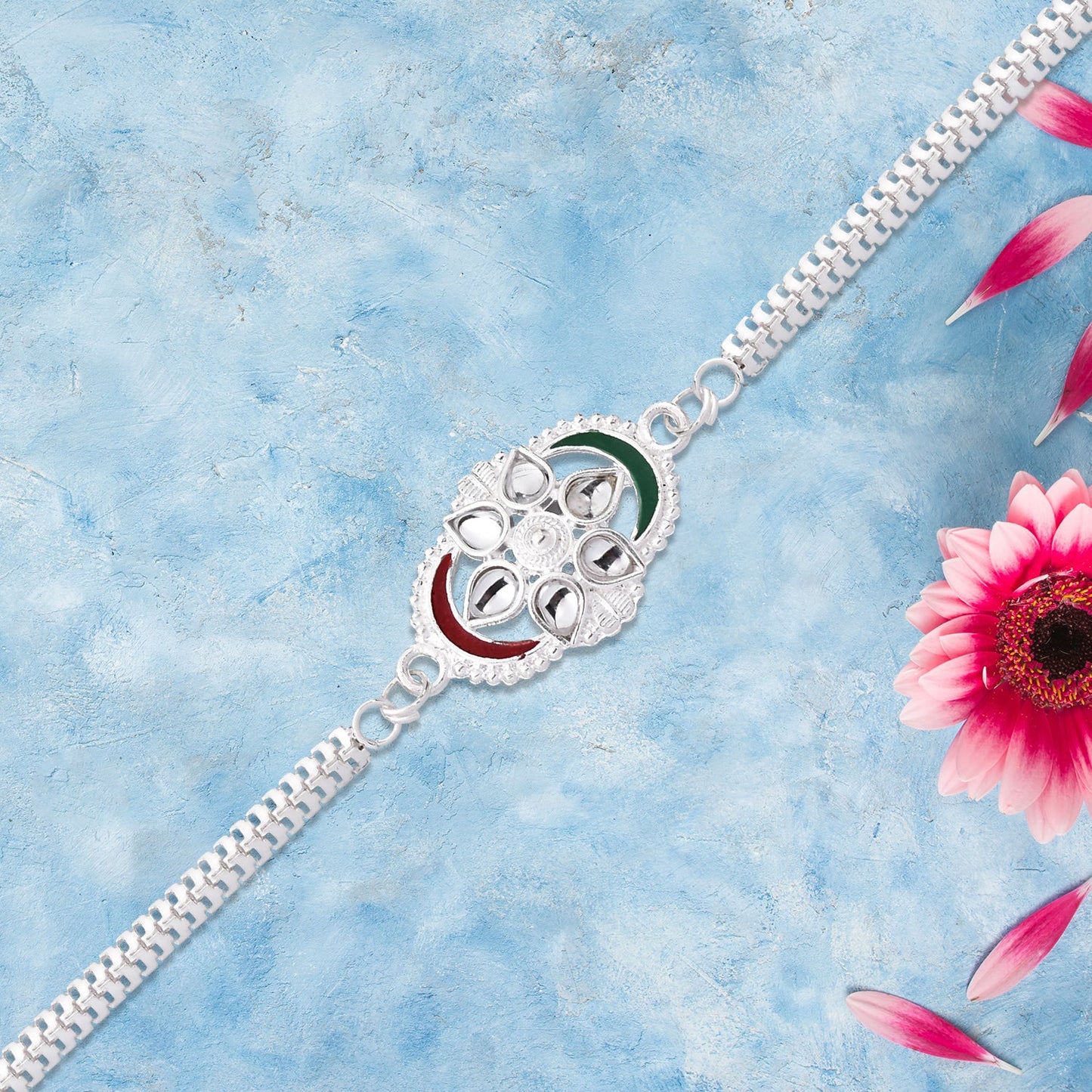 Silver Chain Rakhi with Sparkling Stones and Elegant Red-Green Detailing