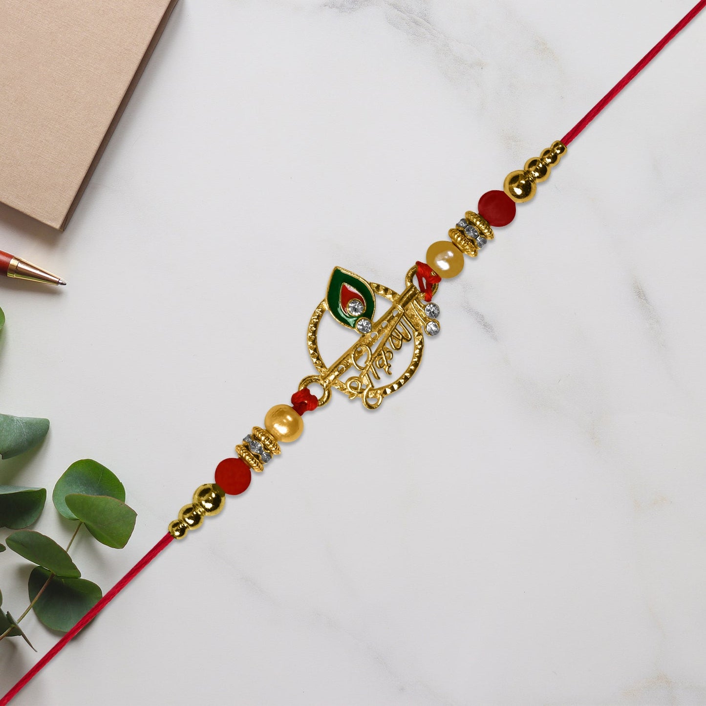 Krishna Name Rakhi with Decorative Beads and Stones