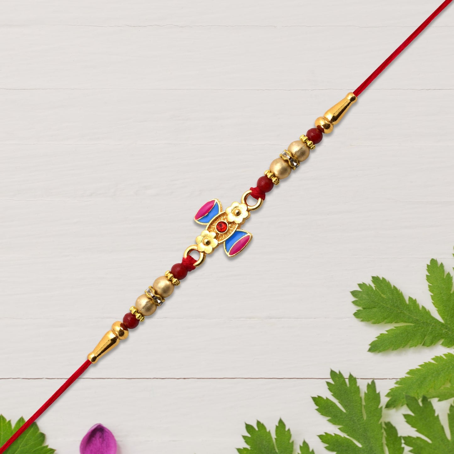 Damru Rakhi with Beads and Floral Detailing