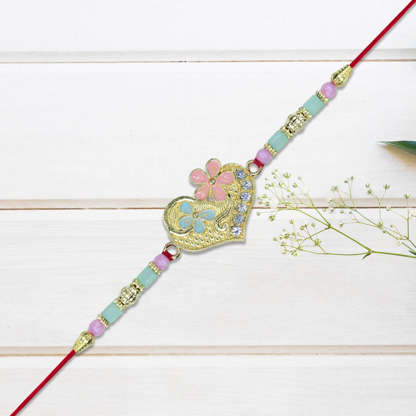 Heart-Shaped Rakhi with Pastel Floral Detailing