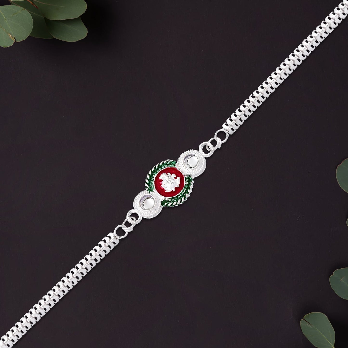 Shiny Silver Rakhi with Ganesha Emblem and Elegant Dual Chain Design