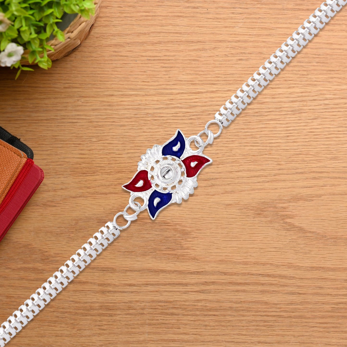 Stylish Sun Design Rakhi with Red-Blue Enamel and Silver-Tone Metal Chain