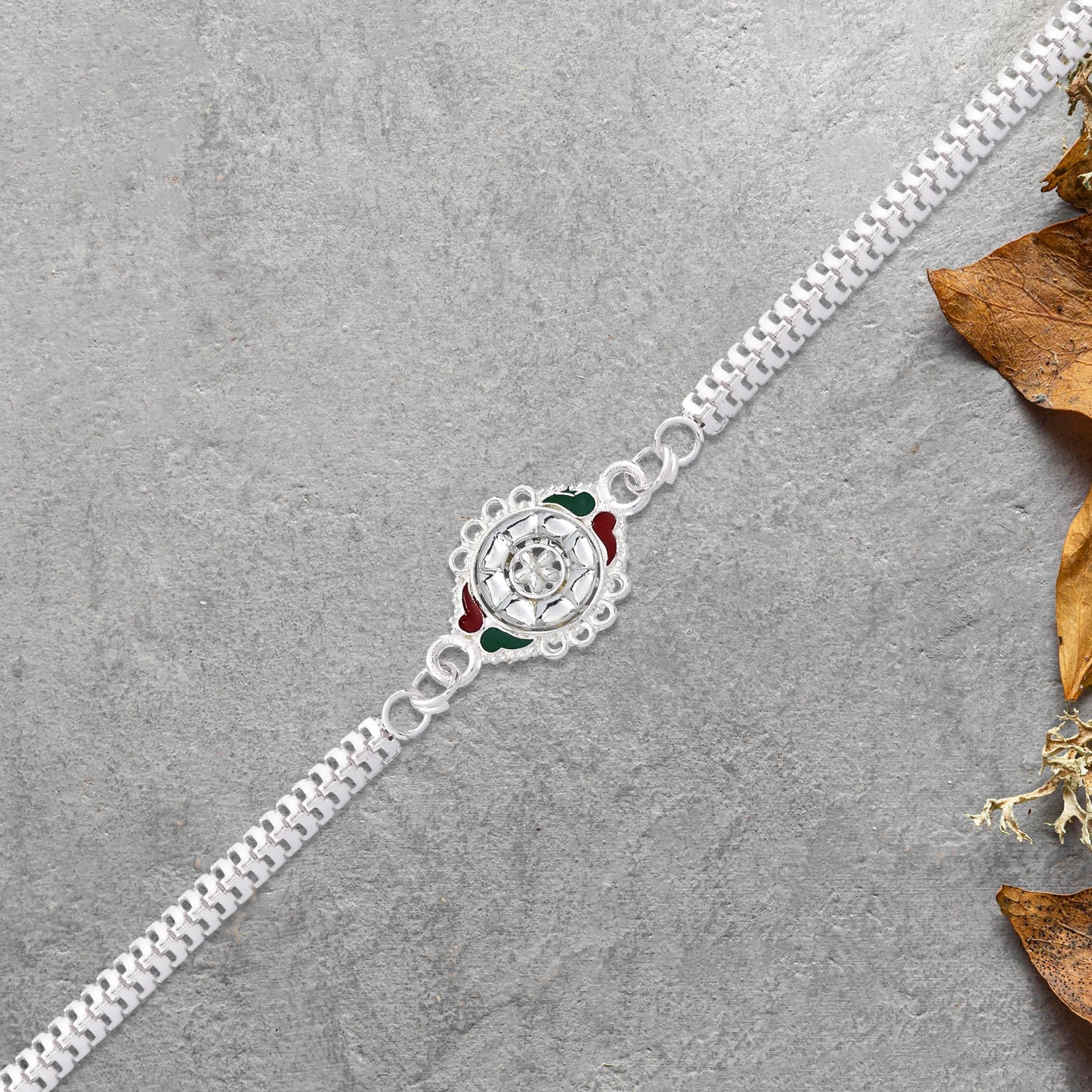 Stylish Rakhi with Intricate Floral Motif and Enamel Touches