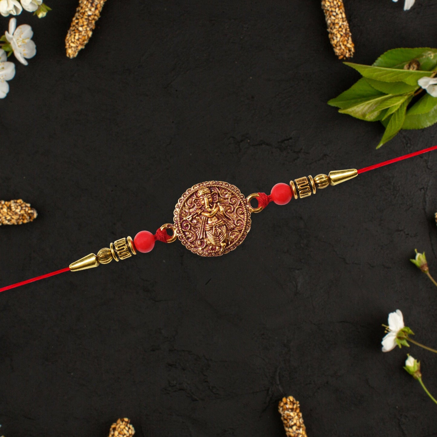 Antique Ganesha Coin Rakhi with Red Beads