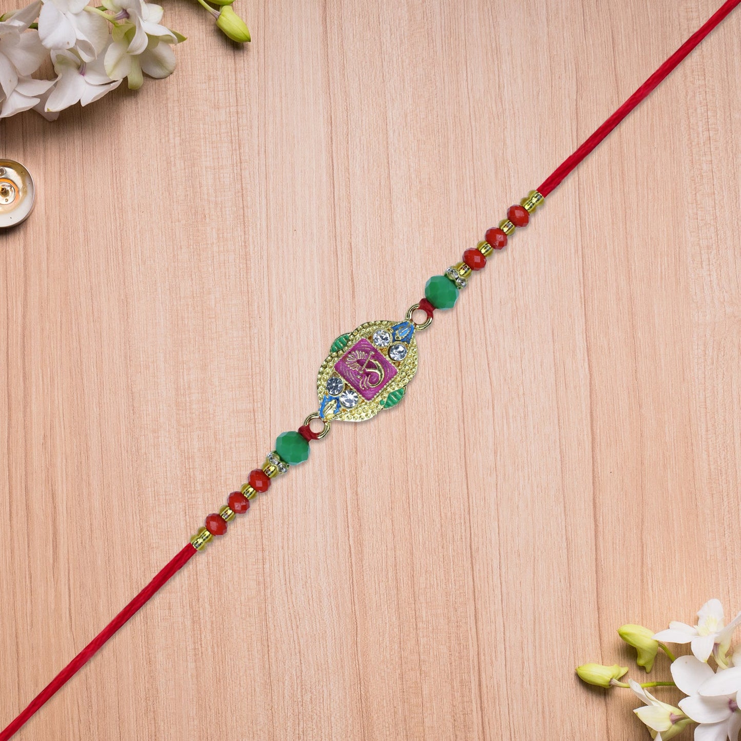 Om Rakhi with Decorative Beads and Stone Work