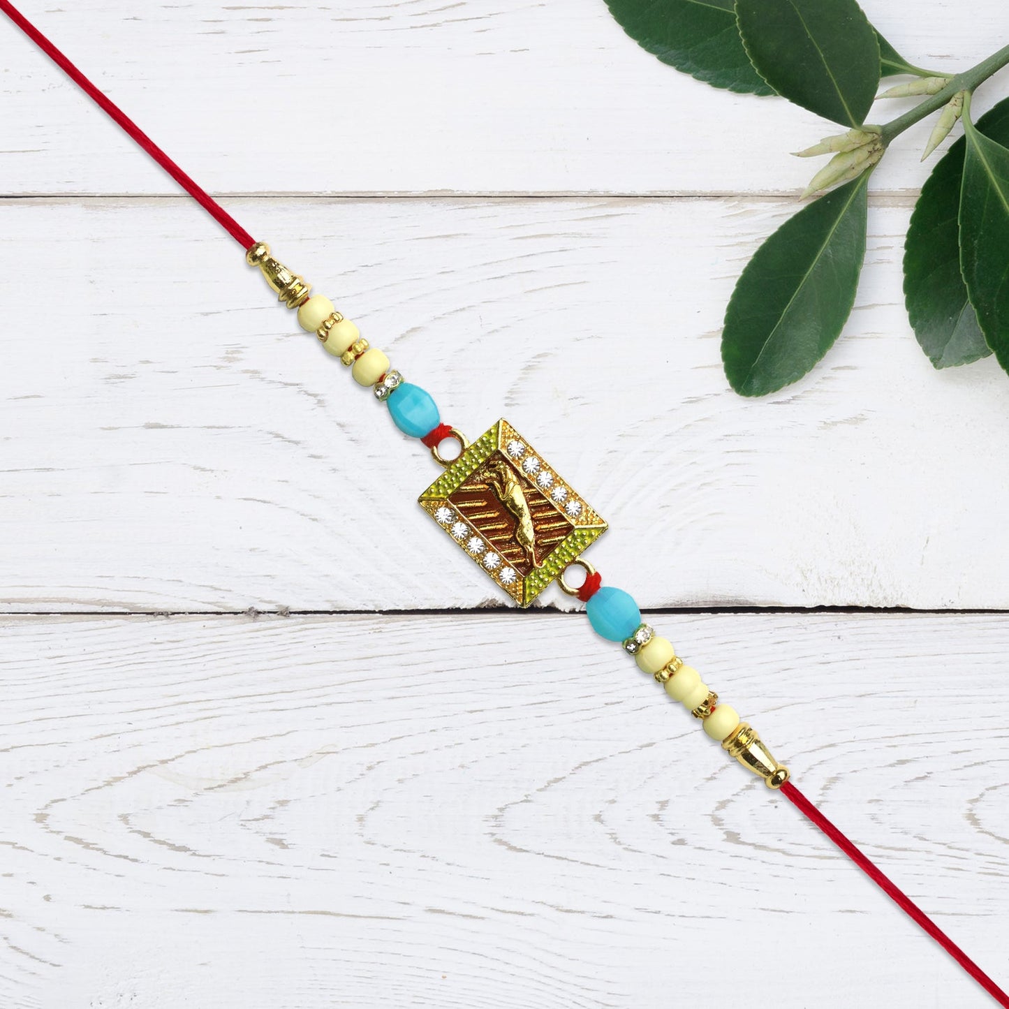 Leaping Deer Rakhi with Stone-Studded Frame and Beads