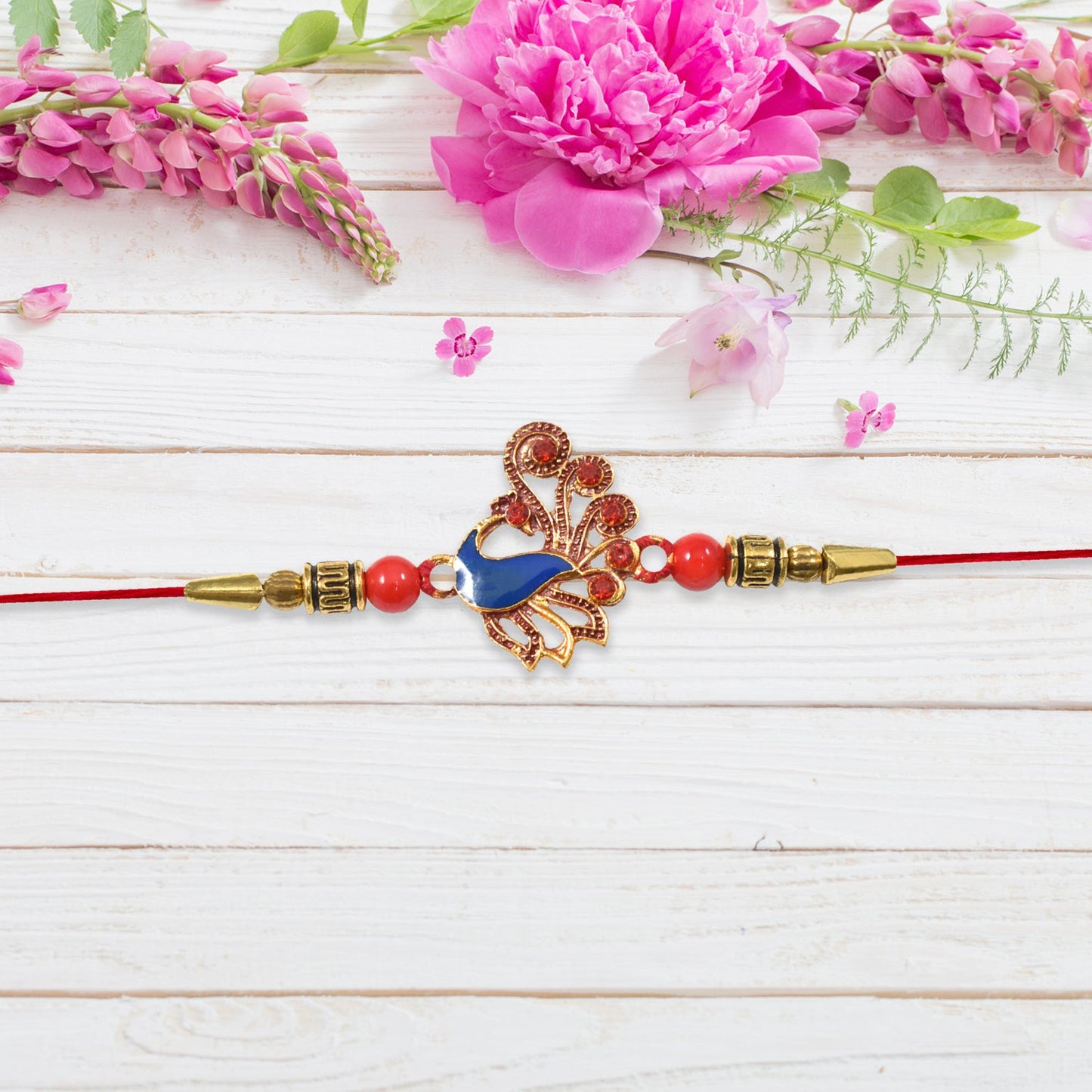 Ethnic Peacock Rakhi with Stone Detailing